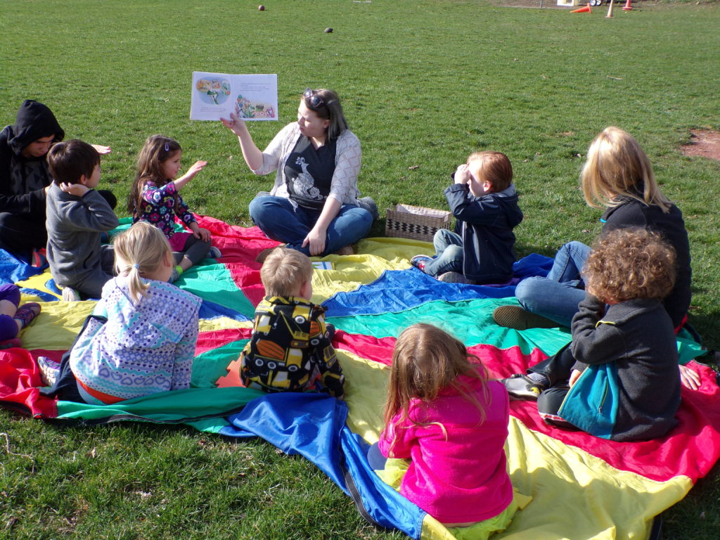 Outdoor circle time at the Coddington Road Community Center, a preschool center in Ithaca NY